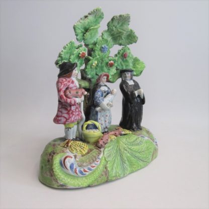 A Staffordshire pearlware 'Tythe Pig' group, depicting the farmer, holding a pig with other produce of bushels of corn and his wife holding a baby.   Circa 1820 - Image 7