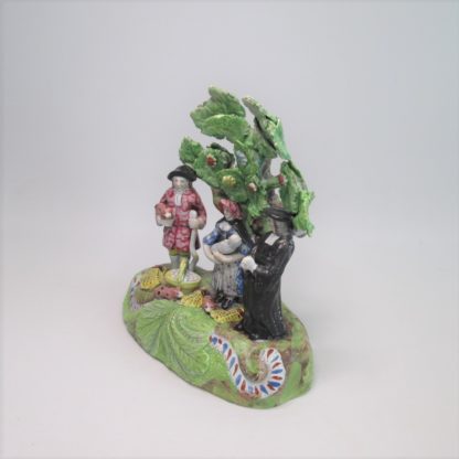 A Staffordshire pearlware 'Tythe Pig' group, depicting the farmer, holding a pig with other produce of bushels of corn and his wife holding a baby.   Circa 1820 - Image 10